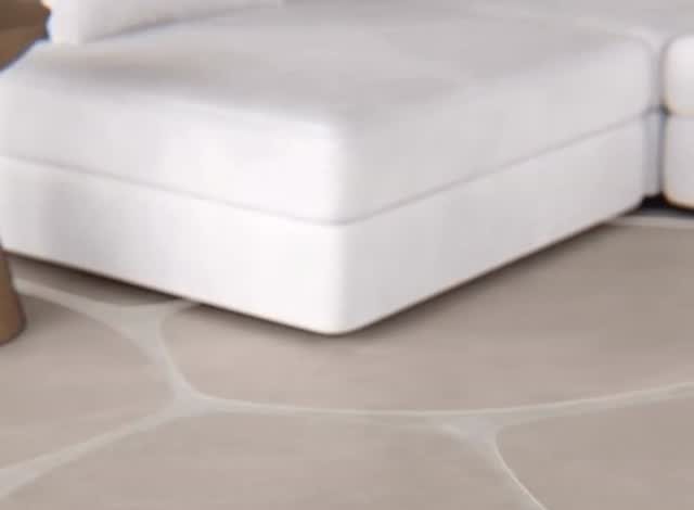 Piso de porcelanato de tom neutro com juntas orgânicas